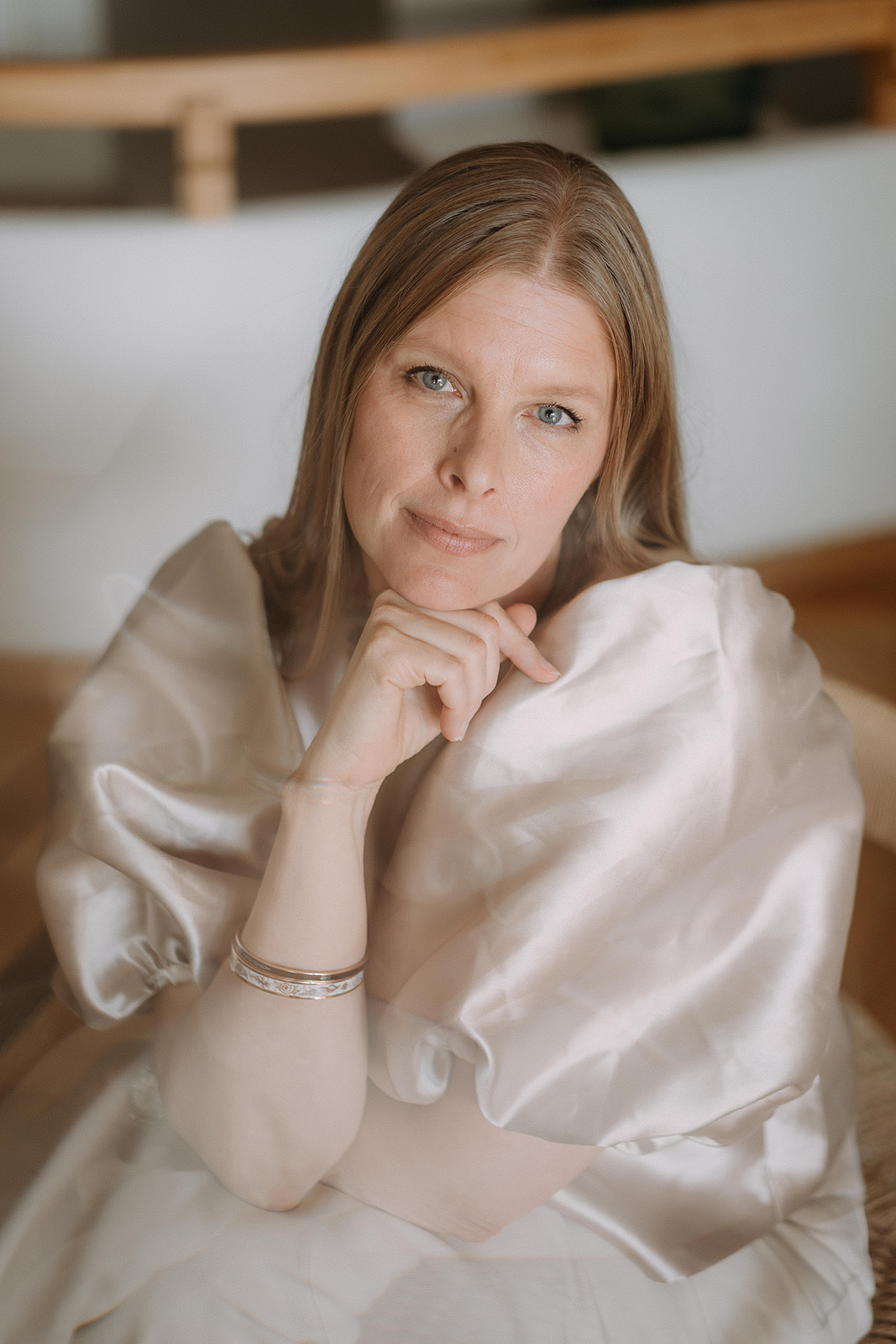 Päivi Halt seated in soft natural light